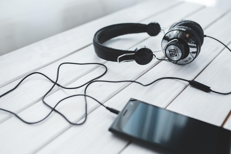 Wired headphones plugged into a phone