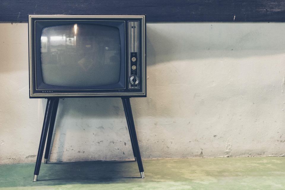 A vintage tube TV on wooden legs